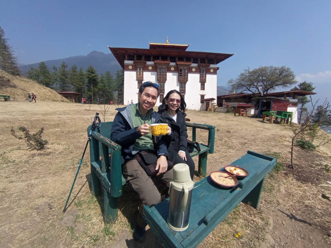 tourists having teabreak at wangditse lhakhang ugyen norbu tenzin